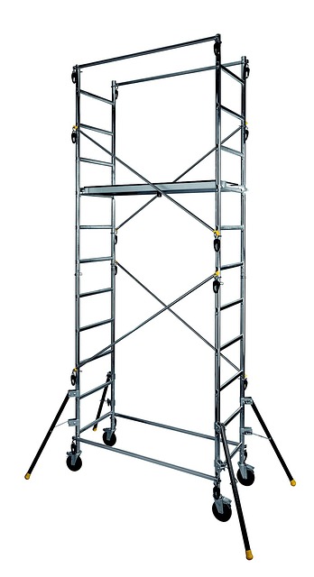 homeowner checking gutters with ladder from safe position